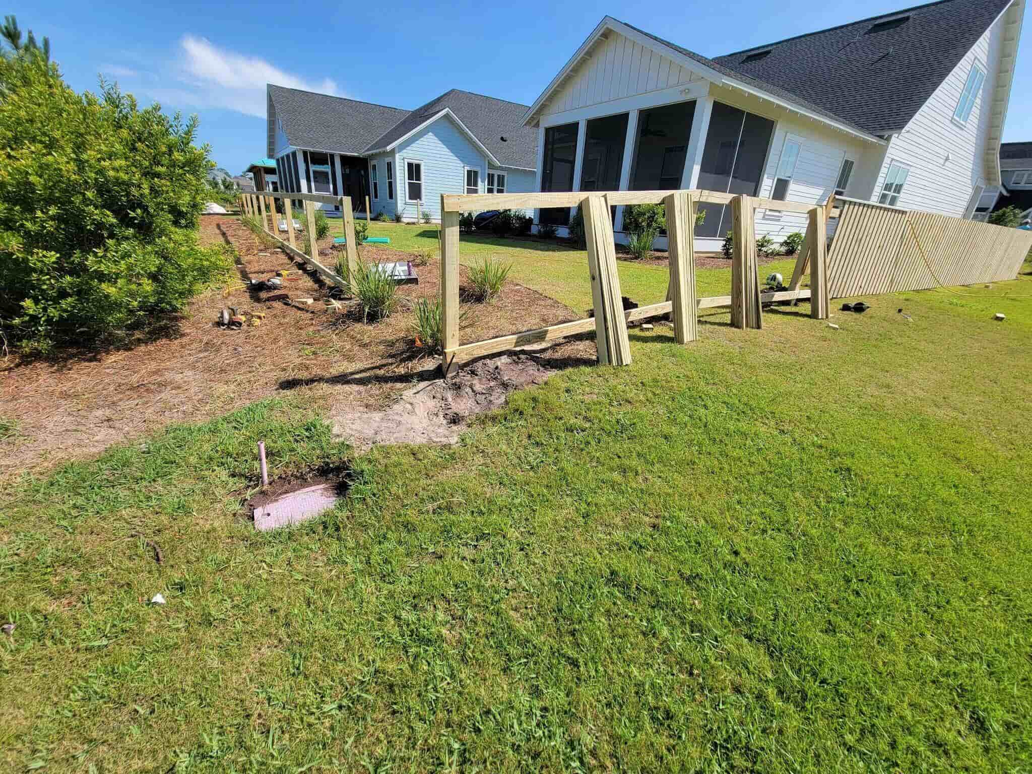 Photo of a wood fence being installed at a residential yard
